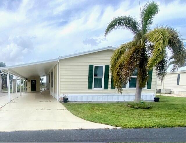 This home is located in Oasis Village, a desirable subdivision that has so much to do. 2 Beadrooms/2Baths, plenty of room for your loves ones to visit, a Florida Room overlooking the lake, with a hot tub. Room to park your Boat, and Lake Okeechobee is right across the street! The Community has lots of activities, A pool, shuffleboard, pickleball, and many planned activities throughout the month. This is a perfect place to stay active or rest and relax as much as you would like. Close to everything, and very convenient . This home is ready for yu to move in!