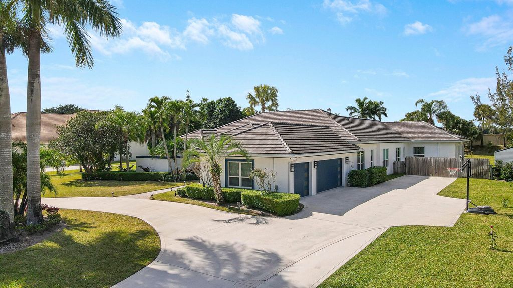 Photo of 8369 Man O War Road, Palm Beach Gardens, FL 33418 (MLS # R10959264)