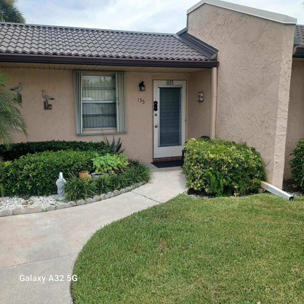 Photo of 155 LAKE MERYL Drive, West Palm Beach, FL 33411 (MLS # B26063999)