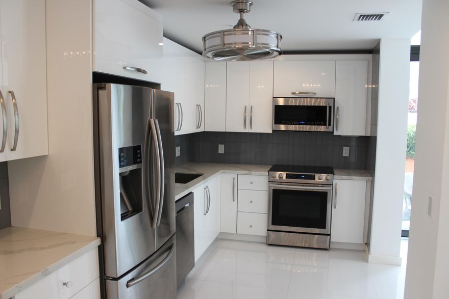 Completely remodeled 1st floor corner unit. All modern amenities. Move in condition, just bring your tooth brush. A private side entrance and side patio just steps away from community pool.Expanded for extra square footage of living space. Millionaire life style for a small investment-Live the Boca West Country Club lifestyle! The country club has new restaurants, (4) golf courses and 30+ tennis courts. World class spa! Mandatory membership required $70,000 one time equity fee, yearly social dues $13,000- other memberships available.Tennis membership free for new buyers as an incentive this year only.