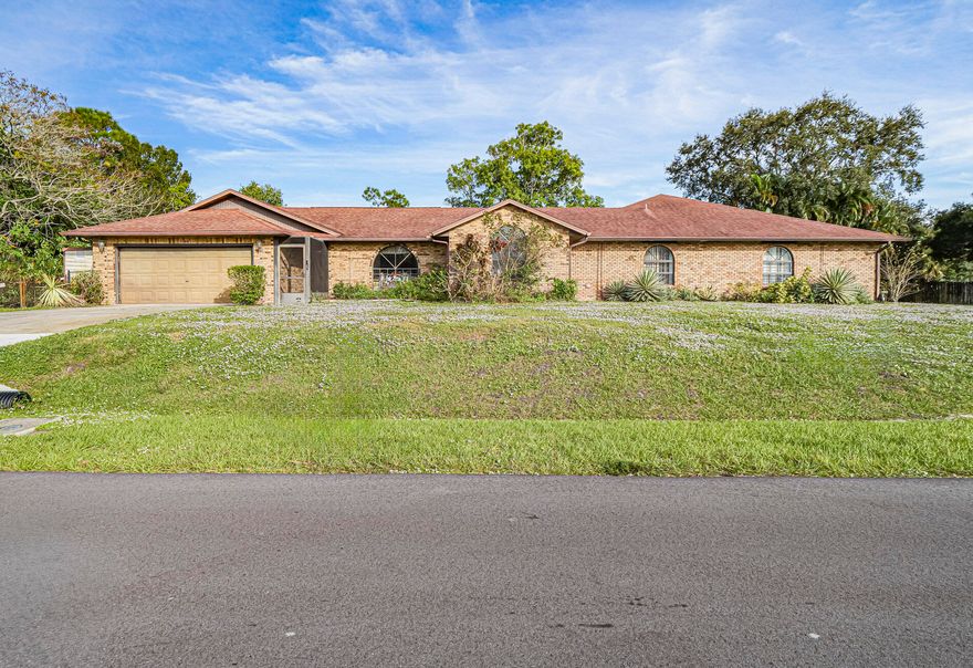 Solar heated pool in Lanie. Great for multifamily living. Two garages, plus two driveways. Custom built. Has all the extras. This is a must see! 125x161 lot on a canal backed up to a preserve. This 4 BR, 3.5 BA split BR plan futures cathedral ceilings and spacious rooms. This house is perfect for entertainment.