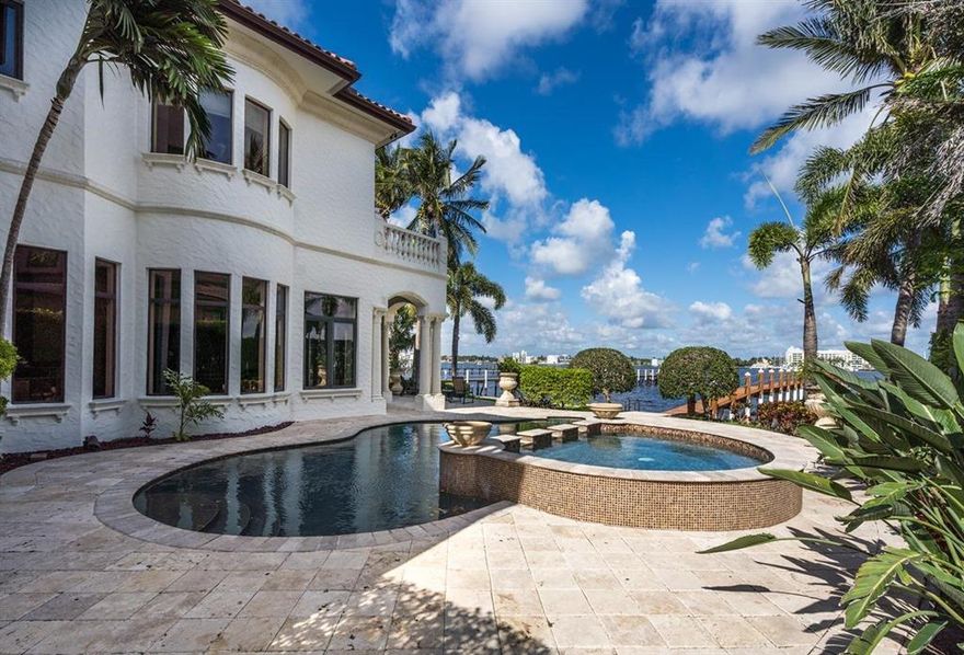 Enjoy spectacular sunsets over the water from this magnificent custom built estate on the desirable north end of Hypoluxo Island.

With cathedral ceilings, a dramatic spiral staircase, elevator, home-theatre, stone fireplace, Viking kitchen, and 2 wet bars, this home is perfect to entertain. 

Outstanding views of the intracoastal from all living areas, a second story walkway overlooking the living areas, a formal dining room, a family room, first floor office and ensuite bedrooms. 

Your patio, outdoor kitchen & pool are just steps away from the wide intracoastal waterway and your 'no-wake' deep water dock that will accommodate a large boat and offers nearby access to the ocean. 

You can also take comfort even in the worst weather with 45KW whole-home generator & impact glass thr Enjoy the spectacular sunsets from this luxurious mediterranean style home on the secluded north end of Hypoluxo Island! 

This open floor plan includes a formal living room with cathedral ceilings, a dramatic spiral staircase, an elevator, a fabulous home-theatre, stone fireplace, morning kitchen,
French doors, and 2 wet bars. The large gourmet kitchen includes Viking appliances, a chef's grade gas stove, a full-size wine refrigerator and a large butler's pantry. You'll find gorgeous finishing touches throughout the entire home like slate tile, glass sinks, bronze hardware and brass & iron scrollwork. 

You have outstanding views of the intracoastal from all living areas, a second story walkway overlooking the living areas, a formal dining room, a family room, first floor office and ensuite bedrooms. The master suite features a romantic waterfront balcony, his & her master baths and spacious walk-in closets.

The outdoor patio area is complete with a heated Pebble Tec pool & spa, a cabana bath, and outdoor kitchen. Your patio & pool are just steps away from the wide Intracoastal Waterway and your 'no-wake' deep water dock that will accommodate a large boat and offers nearby access to the ocean. 

You can also take comfort even in the worst weather with 45KW whole-house generator, impact glass throughout!