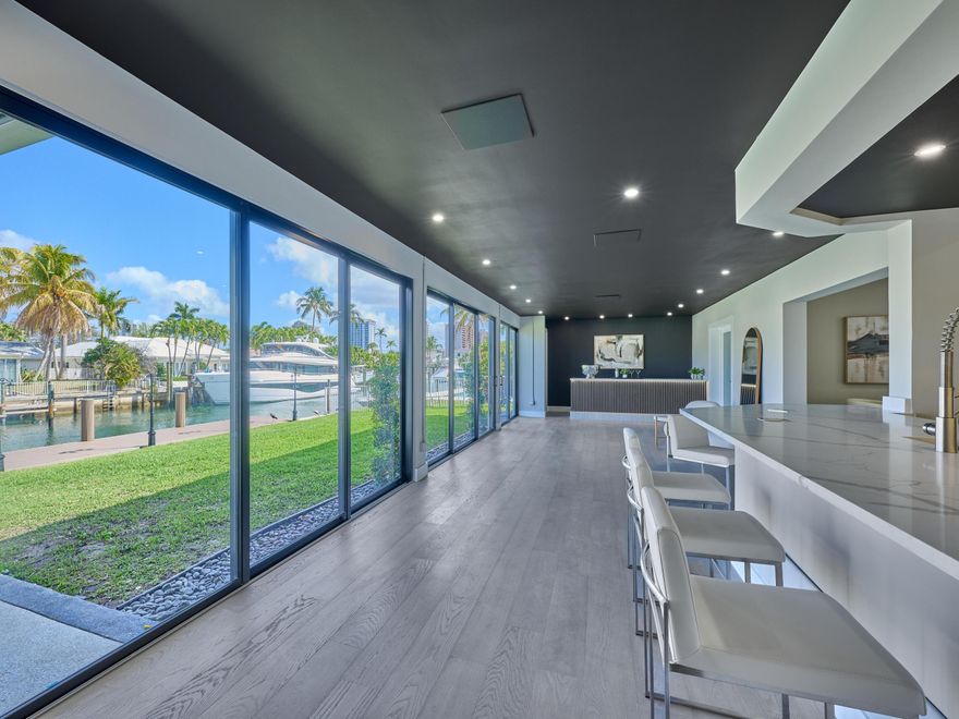 Welcome to 1170 Fairview Ln, a masterfully redesigned and completely remodeled waterfront estate on the highly coveted Singer Island. Designed for the discerning maritime enthusiast, this property features a brand-new dock engineered to accommodate up to an 85-foot yacht, offering unrivaled deep-water access and an exceptional coastal lifestyle.  From the moment you arrive the level of craftsmanship is undeniable. Spanning five generously sized bedrooms and four luxurious bathrooms, this home has been meticulously reimagined to maximize both elegance and functional living. The newly enclosed Florida room seamlessly expands the footprint, providing an expansive, sunlit entertainment space that flows effortlessly into the formal living room, dedicated sitting area, and elegant dining room.  As a strategic real estate asset, this property offers ultimate peace of mind with an uncompromising, top-to-bottom 2025 structural and mechanical overhaul. It is essentially a brand-new home, allowing buyers to bypass the headaches of renovation and immediately enjoy the Singer Island lifestyle.  2025 Uncompromising Upgrades & Features:  Boating: Brand-new dock built to accommodate up to an 85' yacht.  Structural: Brand-new 2025 roof and full-perimeter impact-resistant windows and doors for premium storm protection and energy efficiency.  Mechanicals: All-new plumbing, completely updated electrical systems, new water heater, and brand-new dual AC units.  Interior Finishes: Custom-designed bathrooms, elegant new flooring throughout, and a new washer/dryer.  Exterior & Garage: Striking new driveway, stunning curb appeal, and a full two-car garage with extensive storage space.  This is a rare opportunity to acquire a pristine, structurally fortified waterfront asset in one of South Florida's premier boating enclaves.