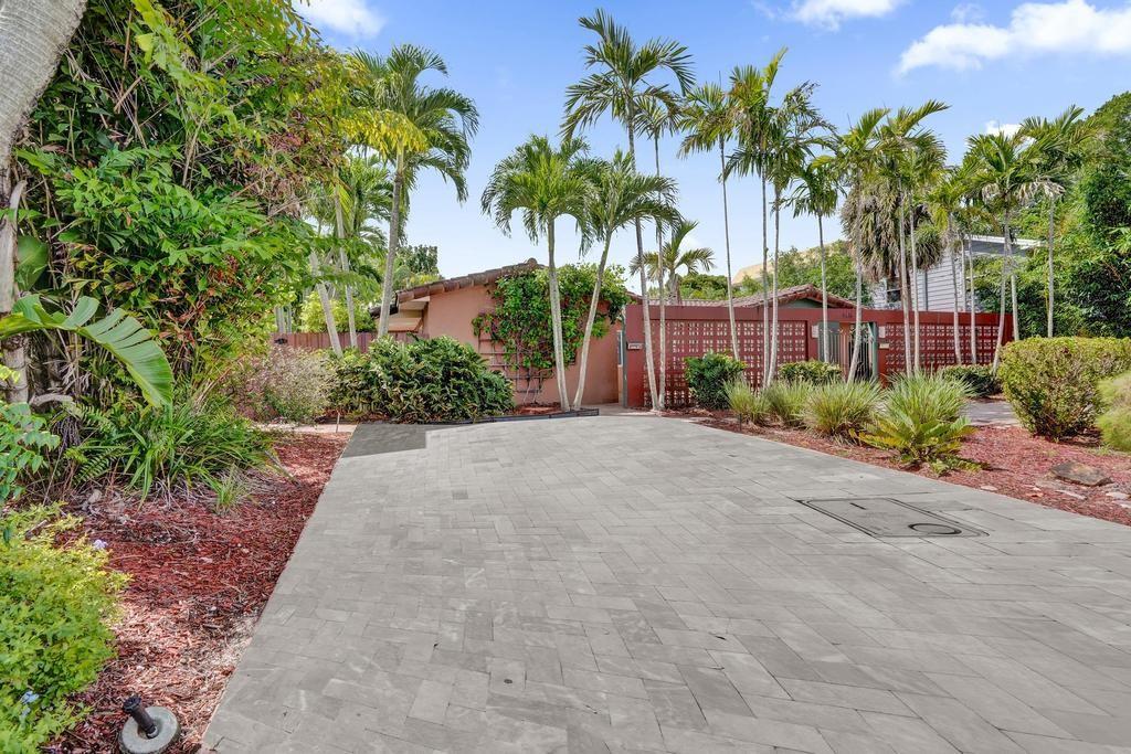 Gorgeous & very private villa/duplex on very quiet street in desirable Coral Ridge Isles neighborhood. This feels like a private home with a separate driveway and entrance and a private front porch for outdoor dining or morning coffee. The property features a large open kitchen, tile flooring throughout, spacious bedroom, impact windows and doors throughout, washer & dryer and a private fenced side yard. The driveway will accommodate at least two cars. Surrounded by single family homes on a quiet street, this property is ideally located in East Fort Lauderdale close to the beaches, Lauderdale by the Sea, shopping, restaurants & entertainment. This is a very unique property: it is a 1 bedroom villa that feels like a single family home.