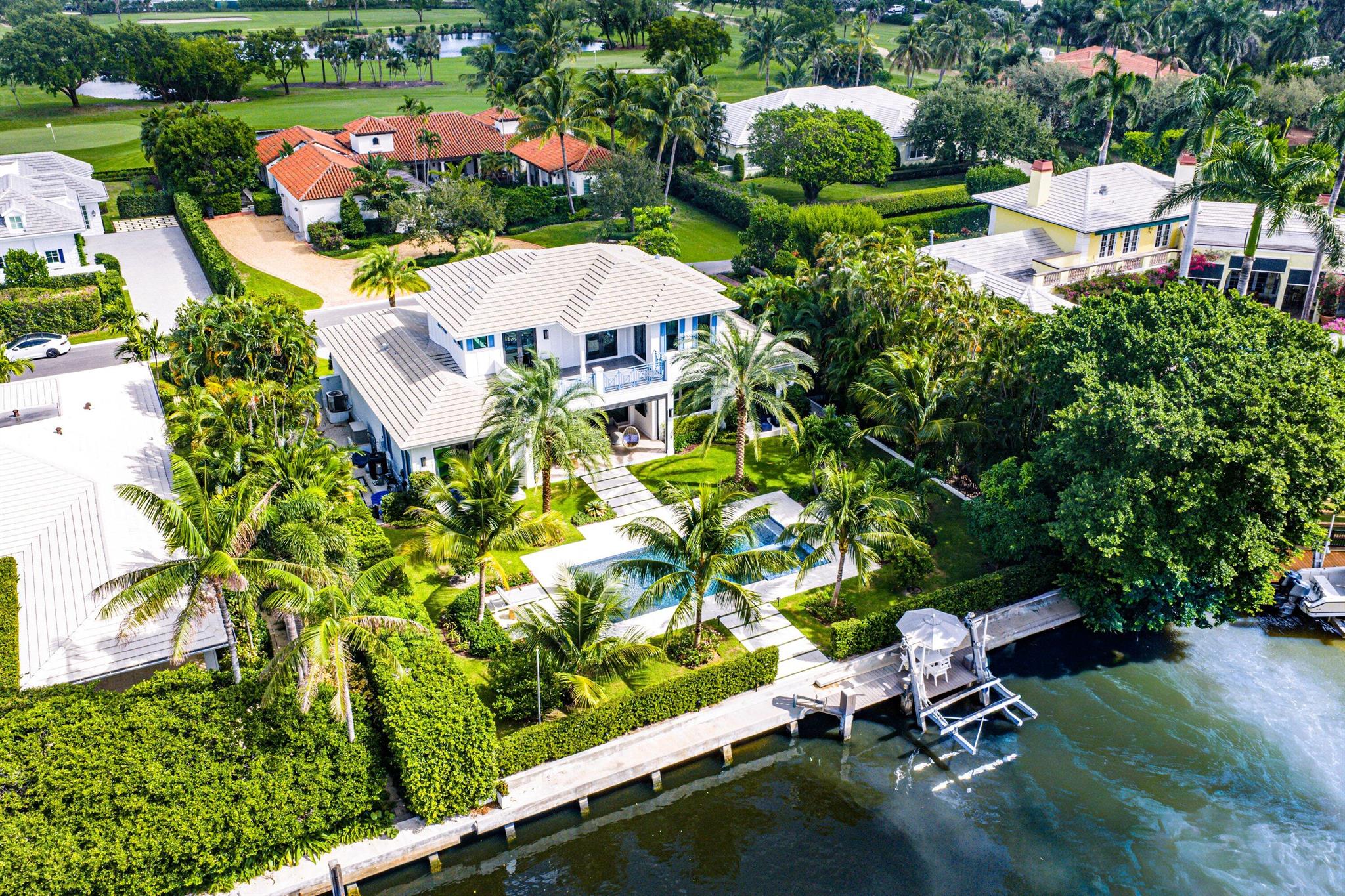 Perfectly positioned in the heart of Gulf Stream, this exceptional residence, designed by renowned architect Richard Jones and recently completed by Marc Julien Homes, sits on a deep, beautifully proportioned lot along a wide deep-water canal, just moments from the beach and the Gulf Stream School. Encompassing 5,103+/- total square feet, this masterfully designed estate offers six bedrooms and six-and-one-half baths. Defined by timeless coastal living and light-filled interiors, the home features a gracious great room with gas fireplace and wet bar, and floor-to-ceiling glass doors that open to panoramic water views creating a seamless connection between indoor and outdoor living.