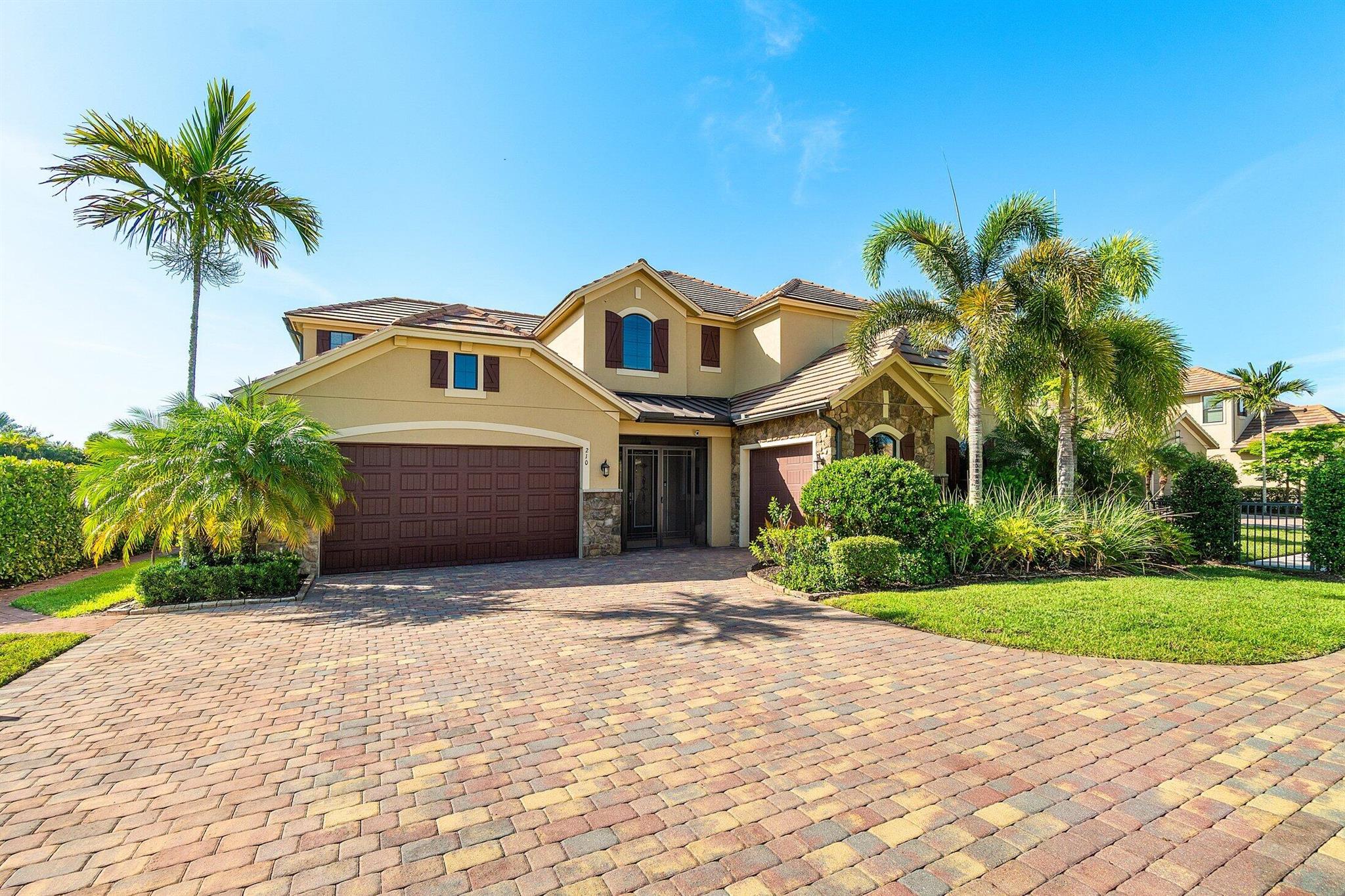 Live in luxury this season and stay in the exclusive gated community of Sonoma Isles located in Jupiter, Florida. Escape to this breathtaking lakefront retreat offering just under 4,500 square feet under air, thoughtfully designed for refined seasonal living. This stunning 4-bedroom, 4.5-bathroom home seamlessly blends coastal elegance with everyday comfort all set in one of Jupiter's most serene and private communities.The expansive open floor plan welcomes you with soaring ceilings, walls of windows, and an abundance of natural light. A chef's dream, the gourmet kitchen features granite countertops, custom cabinetry, a sprawling island, and designer lighting, all opening to a spacious great room and dining area perfect for entertaining or relaxing