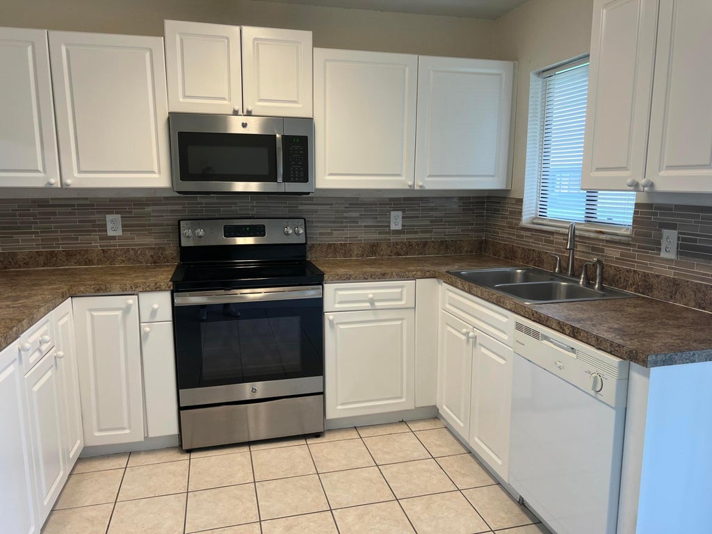 Photo of 650 SW Veronica Avenue, Port Saint Lucie, FL 34953 (MLS # R11011015)