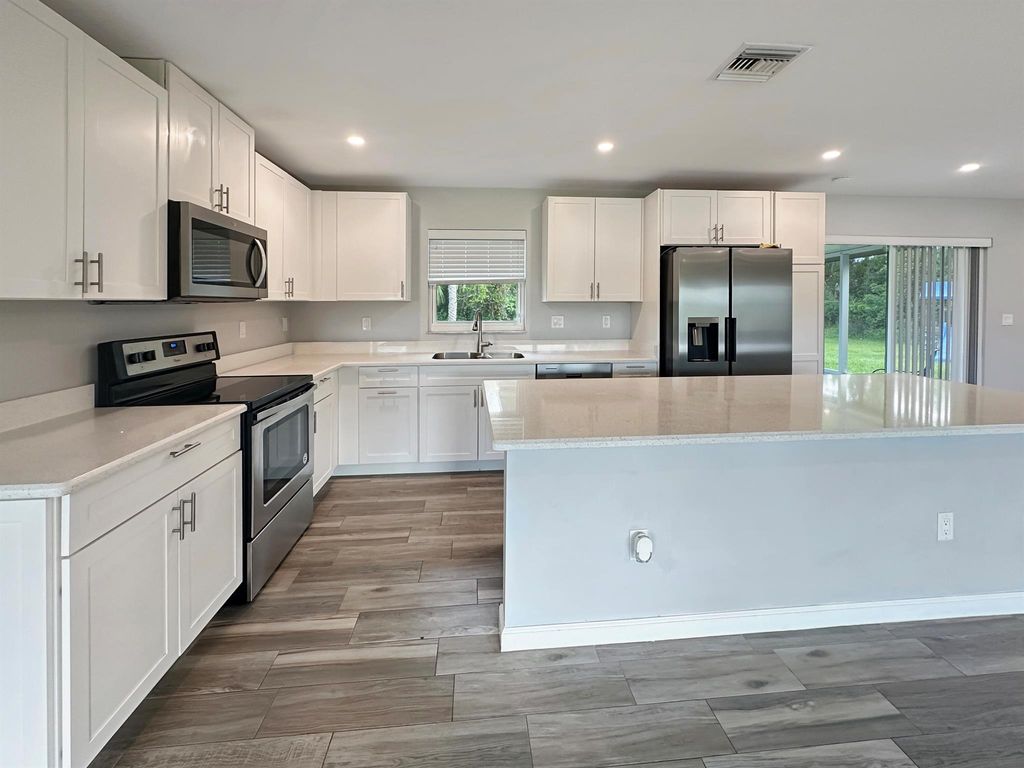 Photo of 5407 Turnpike Feeder Road, Fort Pierce, FL 34951 (MLS # R11125867)