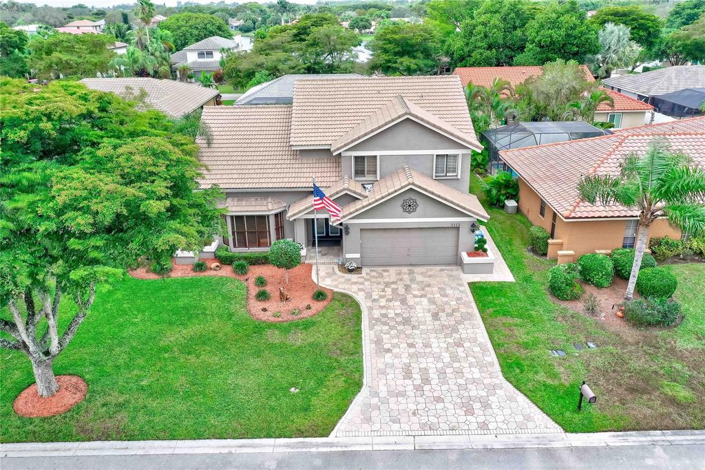 Photo of 5112 NW 58th Terrace, Coral Springs, FL 33067 (MLS # F10417402)