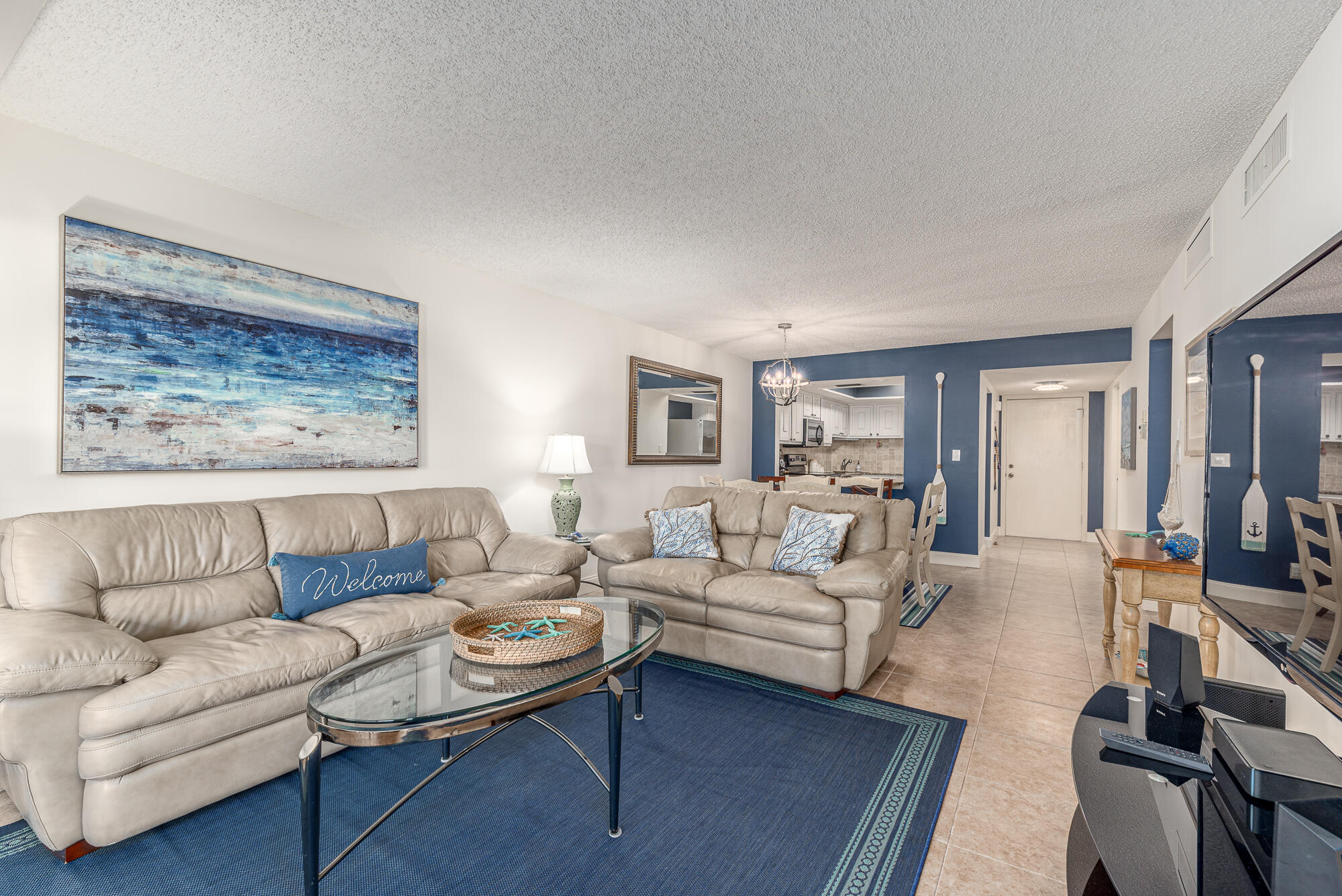 AVAILABLE NOVEMBER AND DECEMBER GORGEOUS 2 Bedroom 2 Bath ''Beachtree'' condo at Ocean Village! Available as furnished for short or long term rental. This 2nd floor end unit has many upgrades and overlooks Remembrance Garden. Primary bedroom features king size bed. 2nd bedroom has a queen bed. Washer & Dryer in unit. Exterior storage closet with beach chairs, bikes, golf clubs. Building has an elevator. Enjoy the best of Florida living at this award winning ocean front community offering 24 hr gated entry, 9 hole par 3 golf, tennis, bocce ball, pickleball, library, fitness room, 4 heated pools, oceanfront restaurant, tiki bar by main pool & 3000 feet of oceanfront. Ocean Village is located on beautiful South Hutchinson Island.