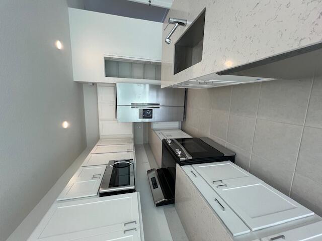 This two-story townhome showcases a contemporary open design among the first-floor kitchen, dining room and living room to promote seamless transitions between spaces. Through sliding glass doors is a terrace for outdoor relaxation. Upstairs caters to all three bedrooms, including the spacious owner's suite complemented by an adjoining bathroom and oversized walk-in closet.