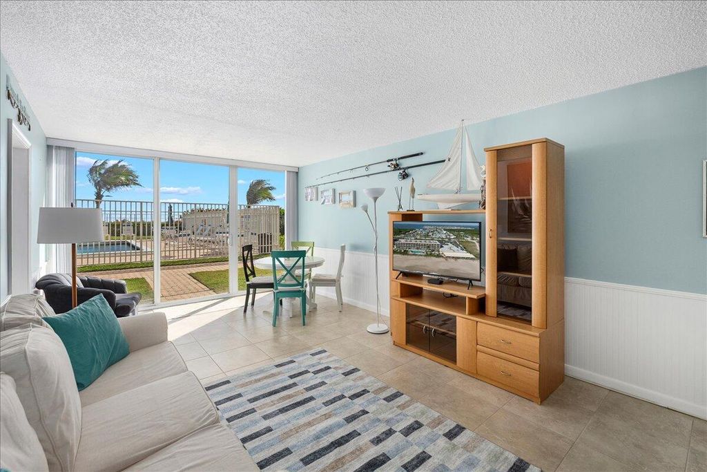 Photo of 9800 S Ocean Drive #105, Jensen Beach, FL 34957 (MLS # R10970536)