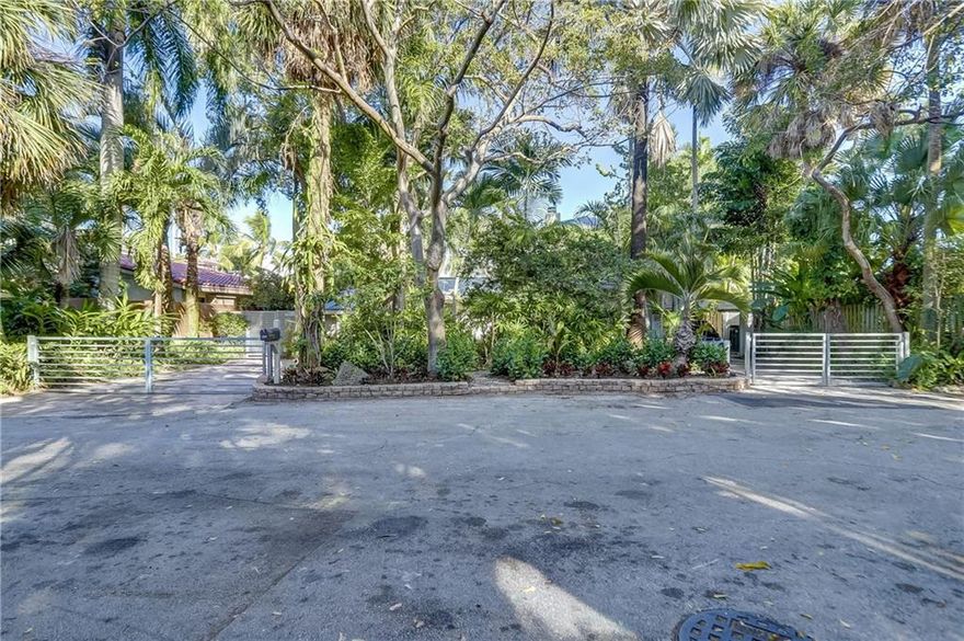 Key West style home on a 75’ deep water, lush and private lot. New raised seawall with new 50’ Aztec dock. New custom retaining wall with travertine pavers around pool. Updated expansive living room with LED lighting, custom wet bar and high-end porcelain floor. Contemporary open staircase leads to private master-suite with balcony overlooking garden, pool and water. Wood floors, fireplace and open kitchen. Two high efficiency ACs. New natural gas Generac 16kw whole house generator. Two new tankless hot water heaters. Salt water pool system with natural gas pool heater and laminair jets with LED lighting. Smart home integration. Two gated driveways and a covered parking space. Fourth bedroom currently used as gym.