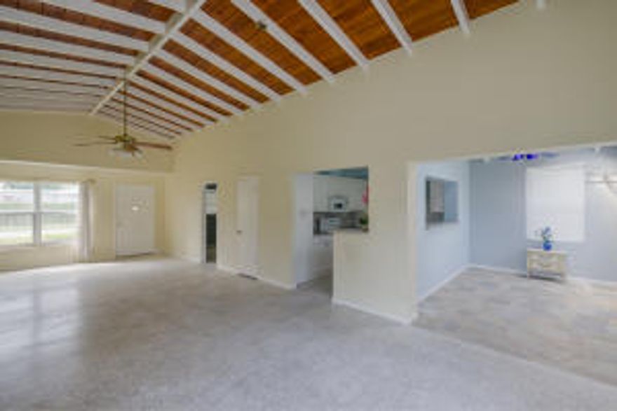 High ceilings, french doors opening to spacious back yard, granite countertops in kitchen.light, open and airy!  Other features are hurricane impact windows (other than sun room), new roof in approximately 2006.  Ideal location in North Palm Beach. So much to offer - close to shopping and great restaurants.  Nearby amenities in neighborhood include golf course plus  Anchorage Park and Marine, bike, jogging, picnic area, tennis, play area, basketball, library!