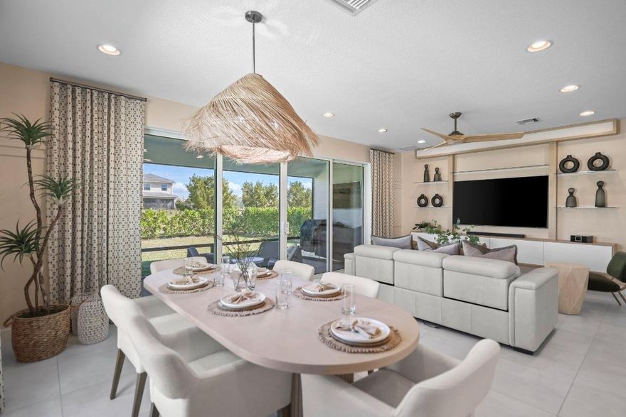 Welcome to luxury living in the Newport Coastal model by GL Homes, ideally located on the covered east side of Arden, just steps from the clubhouse and scenic trails. This mint-condition 4-bedroom, 3.5-bath home has been remodeled with over $150,000 in high-end upgrades and feels like a designer model. Highlights include custom wallpaper throughout, upgraded light fixtures, blinds, a built-in entertainment center, and a seamless open layout perfect for entertaining. a FULL huse generator adds peace of mind year-round. Enjoy a private outdoor living space with a built-in grill, screened in patio and outdoor TV. Truly turnkey and crafted for the pickiest buyer.