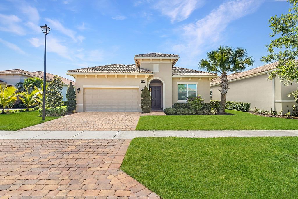 Photo of 8641 SW Carrara Way, Port Saint Lucie, FL 34987 (MLS # F10415795)