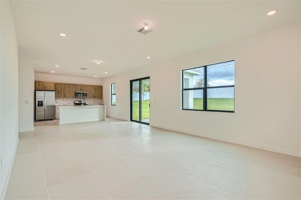 Photo of 2034 NE Ocean Dunes Drive, Jensen Beach, FL 34957 (MLS # R10930128)