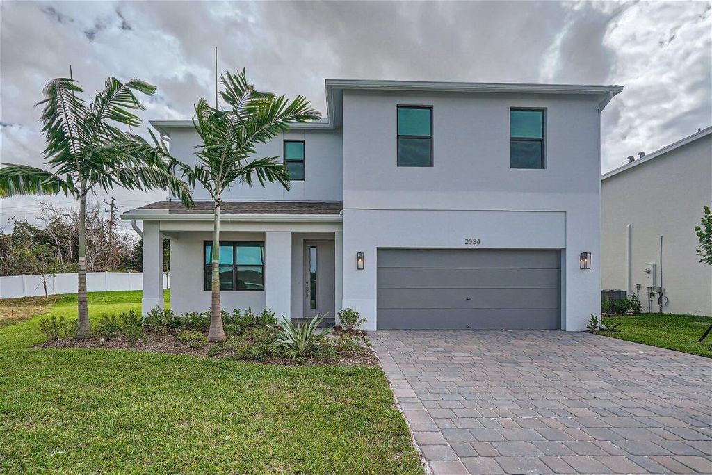Photo of 2034 NE Ocean Dunes Drive, Jensen Beach, FL 34957 (MLS # R10930128)
