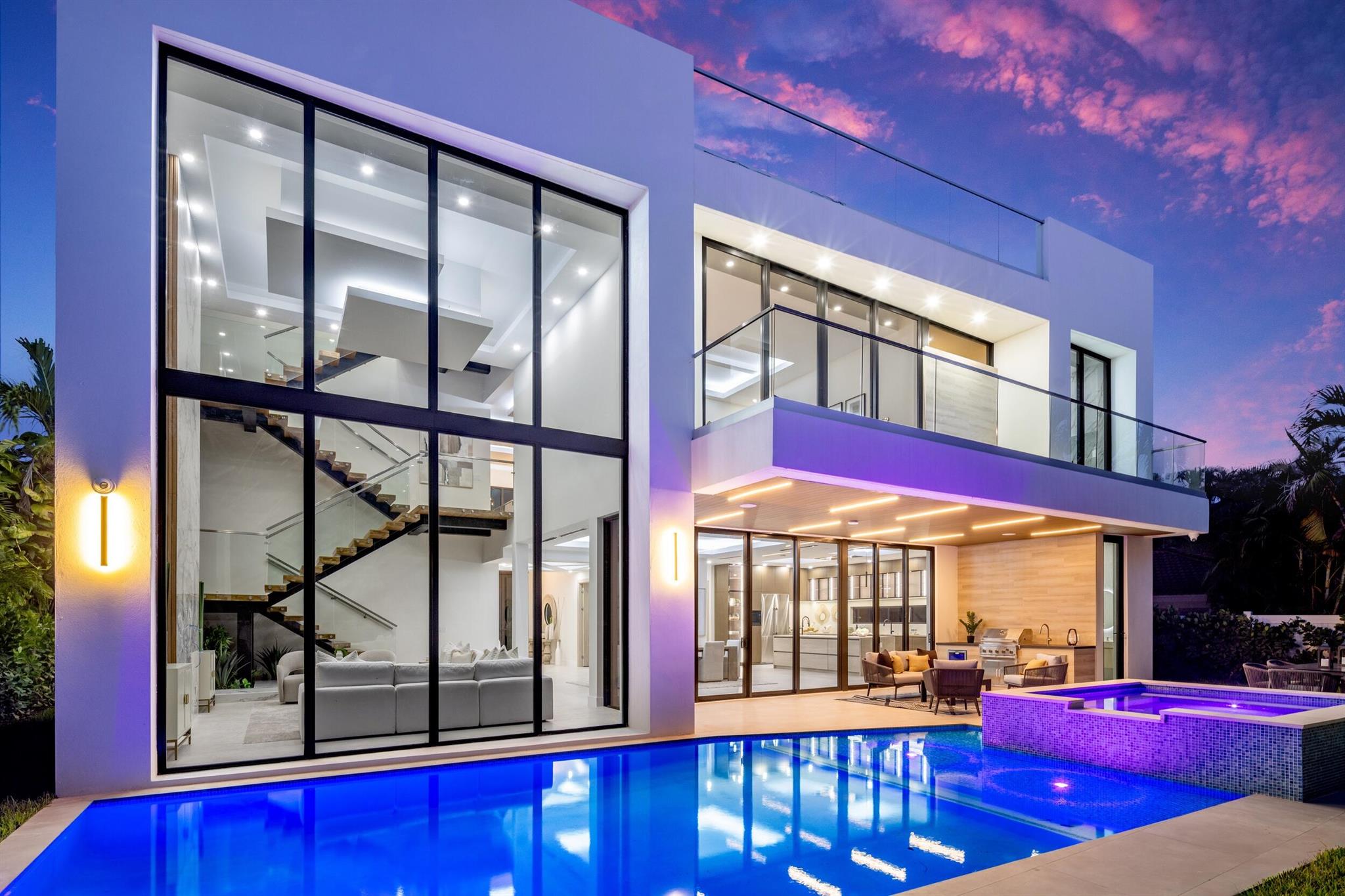 Three Levels of Custom Luxury in East Boca RatonThis newly constructed estate offers more than 9,200 total square feet of modern architecture and resort-style design. Situated in one of Boca Raton's most sought-after neighborhoods, the home combines scale, elegance, and convenience across three levels.The open-concept main floor is designed for both daily living and entertaining, featuring a dramatic floating staircase, double-height ceilings, and a full chef's kitchen with premium appliances, stone counters, and custom cabinetry. The home includes six bedrooms, eight full baths, one powder room, a private gym, and an elevator that connects every level.