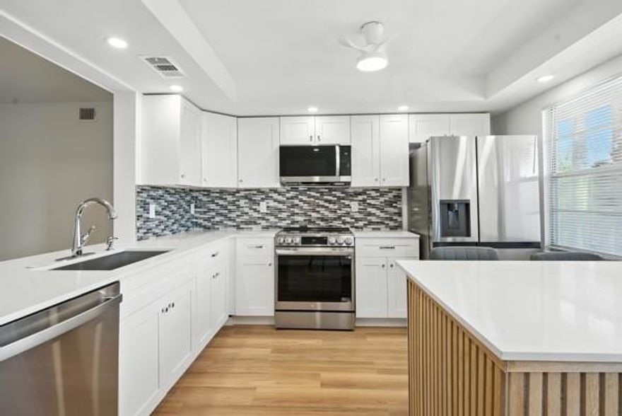 FULLY RENOVATED 2nd FLOOR CONDO. EXPERIENCE RESORT STYLE. THIS BRIGHT AND SPACIOUS UNIT FEATURES A MODERN OPEN KITCHEN WITH STAINLESS STEEL APPLIANCES, QUARTZ COUNTERTOPS, UPDATED BATHROOMS, NEW A/C.  THE COMMUNITY OFFERS GREAT AMENITIES, INCLUDING A POOL, BBQ AREA, AND 24/7 GATE SECURITY FOR YOUR PEACE OF MIND .55 + MOVE IN READY.