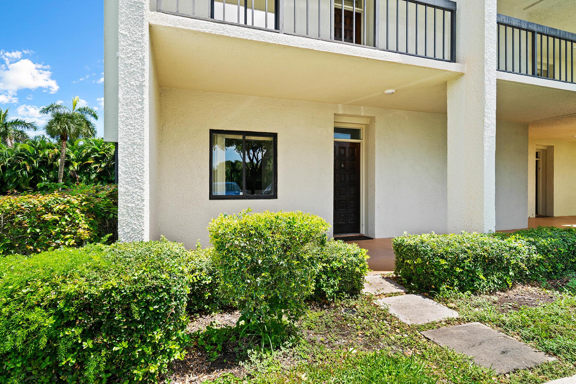 Big beautiful all ages first floor 2 bed 2 bath corner in Lands of the President! Some photos virtually enhanced. Unique wrap-around screened porch to enjoy the sprawling serene green space in the backyard. It's like living in a single family home! Inside, find shiny modern tile flooring throughout, elegant kitchen with rich dark cabinets, granite counter tops, stainless steel appliances and in-unit laundry. Bedrooms are thoughtfully separated by large open living space. Pool just a few steps away. Location is priceless; minutes to PBI, I95, beautiful Palm Beach, bustling downtown West Palm Beach with shopping, restaurants and all the great amenities you love, yet serene and secluded. It's time: leave the stress, come decompress, and LOVE WHERE YOU LIVE!
