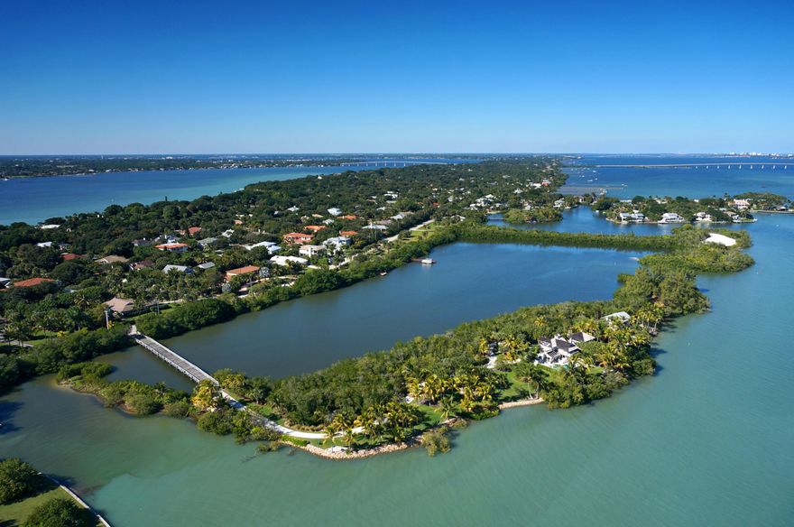 Memories are made here! A tropical oasis with tranquil blue waters, sandy white beaches, swaying palms and perfect southeastern exposure paints a picture of the island lifestyle. Once in a lifetime does an uber-property like this come on the market! Accessed by a private bridge with 2,700+/- ft. of shoreline surrounding the 3.4+/- acre island, allowing for
ultimate privacy and endless water fun. This unique property offers two seaside cottages, designed by renowned architect, Peter Jefferson. The island offers for plenty of room to host family and friends in a tranquil, laid back atmosphere without leaving the urban benefits of shopping & dining. Deep water with dock permit, ocean access, close to executive airport. Own your own island right here in Stuart, FL