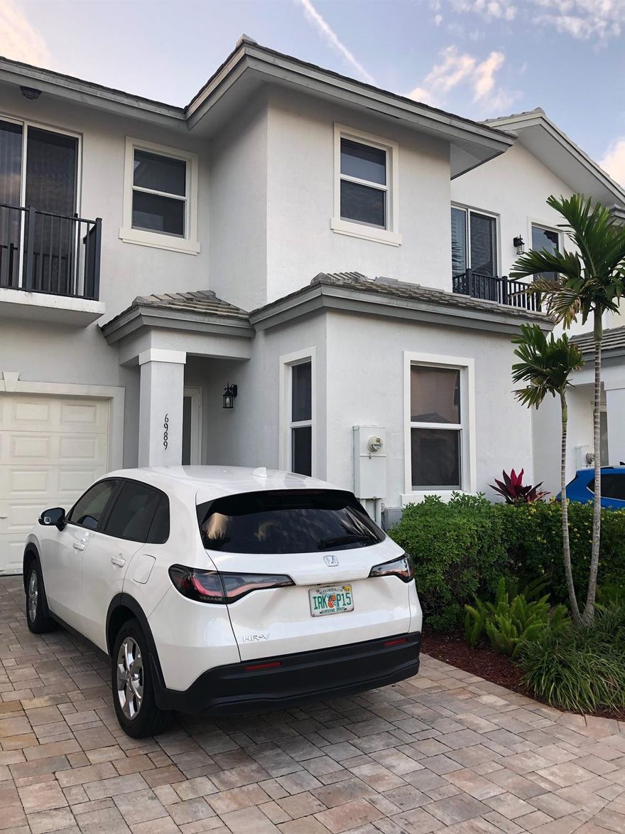 Beautifully updated 3-bedroom, 3 full-bath townhome located in a newer 2019-built community in the heart of Coconut Creek. This spacious home features a full bedroom and bathroom on the first floor, perfect for guests. Enjoy newer wood flooring on the stairwell and throughout the upstairs, with durable ceramic tile downstairs. The upstairs laundry adds everyday convenience. Situated in a gated community with very low HOA fees, this property is just minutes from shopping, dining, entertainment, and beaches. Excellent opportunity for investors with no rental restrictions. Located next to A+ rated private and public schools. A must-see home in a prime location!