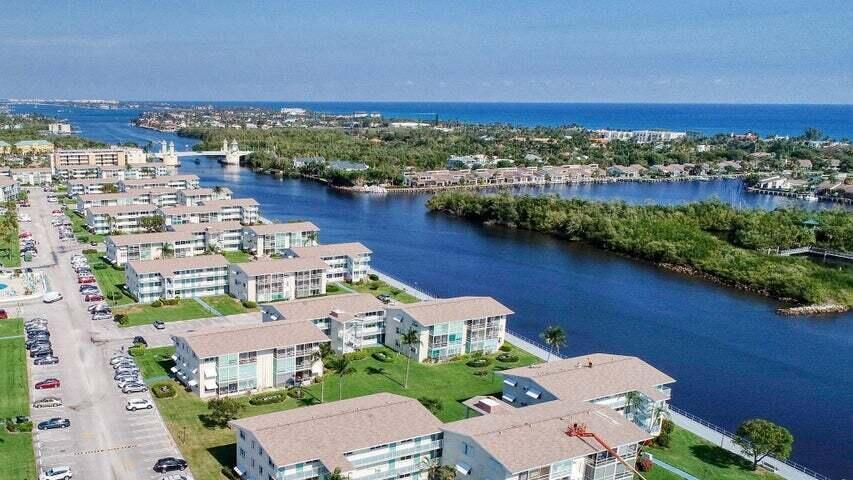 SUPER LOCATION IN POPULAR 55+ SNOWBIRD COMMUNITY OF STERLING VILLAGE. 2ND FLOOR, END UNIT CONDO IN 3 STORY-ALL CONCRETE-ELEVATOR BUILDING! IN MIDDLE OF VILLAGE AND ACROSS FROM CLUBHOUSE, POOL, FITNESS CENTER AND ALL OTHER AMENETIES AND ACTIVITIES PROVIDED. #530 BUILDING SITS NEXT TO 1/2 MI PROMENADE THAT FOLLOWS INTRACOASTAL. ENJOY FISHING, WALKING OR BIRD WATCHING ACROSS THE WATER AT PROTECTED WILDLIFE REFUGE. NOTHING CAN EVER BE BUILT HERE, SO UNSPOILED VIEW WILL REMAIN! CONDO HAS BEEN BEAUTIFULLY REMODELED! POPCORN REMOVED, CROWN MOLDING ON CEILINGS AND DECORATIVE MOLDING INSTALLED ON ALL WINDOWS. KITCHEN IS OPEN CONCEPT, HAS GRANITE COUNTERS, CUSTOM BACKSPLASH, MATCHING WHITE APPLIANCES INCLUDING DISHWASHER AND CABINET STORAGE GALORE! WASHER/DRYER, LINEN CLOSET W/ EXTRA.. (PG2)..