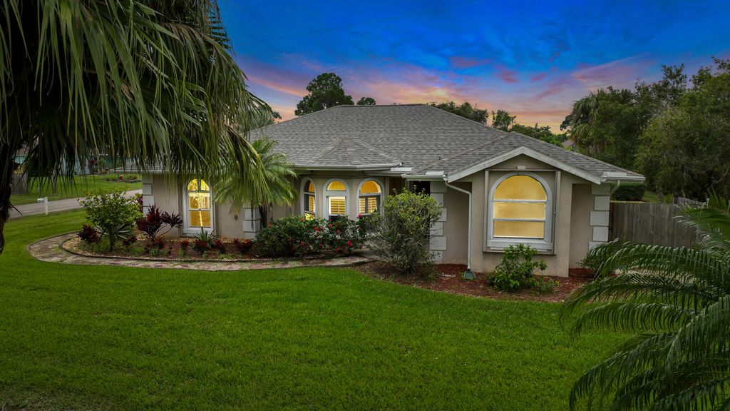 Photo of 3612 SW Vollmer Street, Port Saint Lucie, FL 34953 (MLS # R10852179)