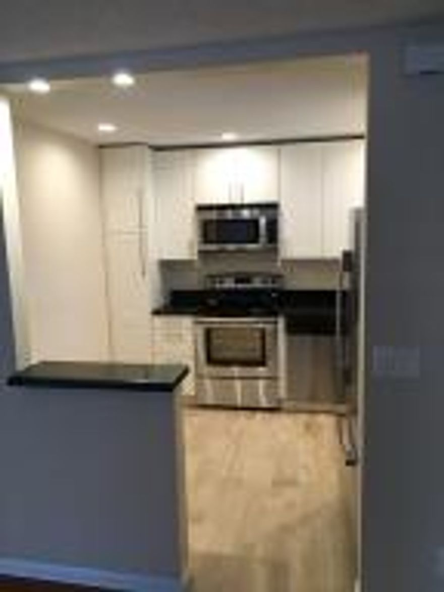 Must See. Updated Unit with Laminate Flooring   throughout the Living Area and Tile in Kitchen, Foyer and Bathrooms. Kitchen completely Re-Modeled with Granite Counter Tops and Stainless Steel Appliances. Bathrooms completely Re-Modeled with new Vanities and Commodes. 2 pets <20. Interview required  ($100 application fee). No Renting 1st 2 years. 12% deposit required. No RV's or commercial vehicles. Master Assc Qrtly dues $140.00