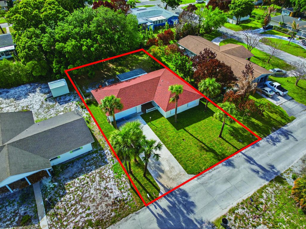 Photo of 1905 Colonial Road, Fort Pierce, FL 34950 (MLS # B26005134)