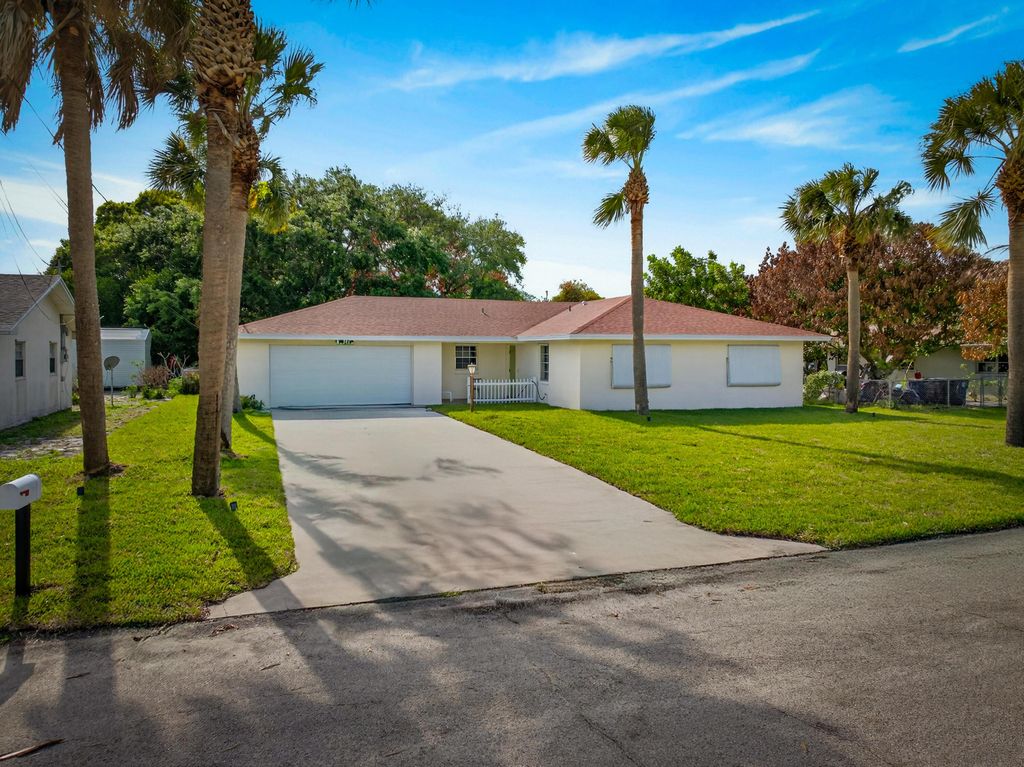 Photo of 1905 Colonial Road, Fort Pierce, FL 34950 (MLS # B26005134)