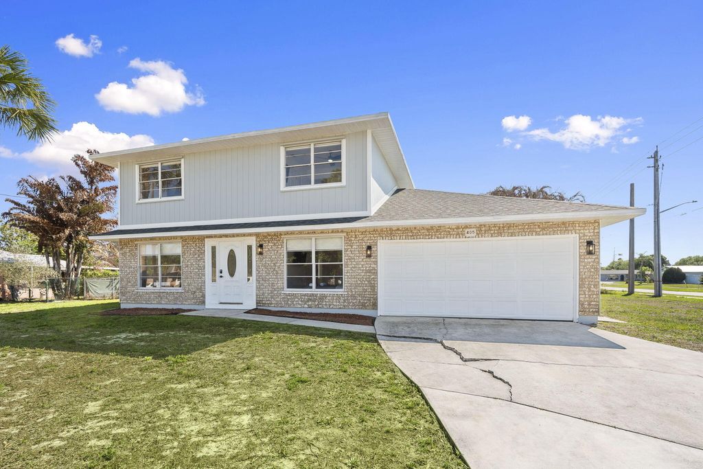 Photo of 405 NE Midvale Street, Port Saint Lucie, FL 34983 (MLS # B26008050)