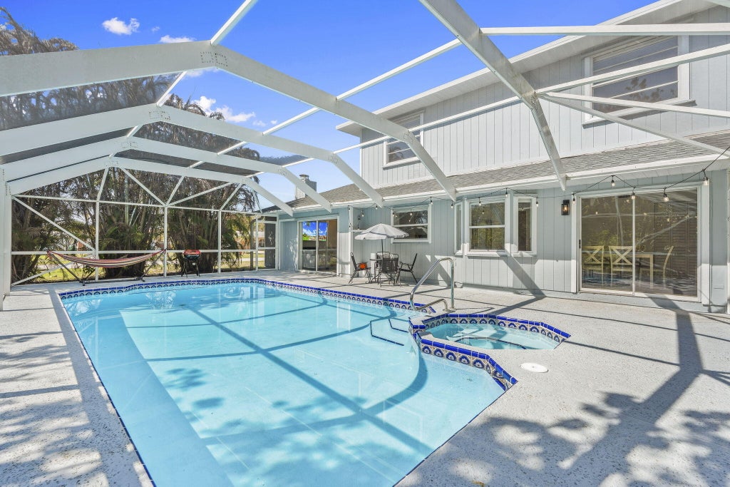 Photo of 405 NE Midvale Street, Port Saint Lucie, FL 34983 (MLS # B26008050)