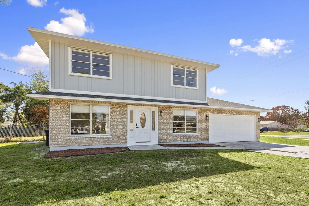 Photo of 405 NE Midvale Street, Port Saint Lucie, FL 34983 (MLS # B26008050)