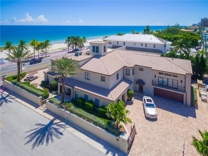 Oceanfront views are enjoyed throughout this gated, private residence located just steps from the beach. This California inspired estate is situated on a large, 15,260 SqFt corner lot with 10,852 SqFt of living space. Enjoy North Atlantic Ocean sunrises from the large master bedroom complete with an office/sitting room/nursery. Oceanfront pool and spacious patio are ideal for entertaining and enjoying the South Florida lifestyle. The formal foyer opens up to a generous living room, dining room, family room and kitchen. Massage room/salon, club room, 6 bedrooms, 6.5 bathrooms, and mother in law suite, complete this impressive estate.