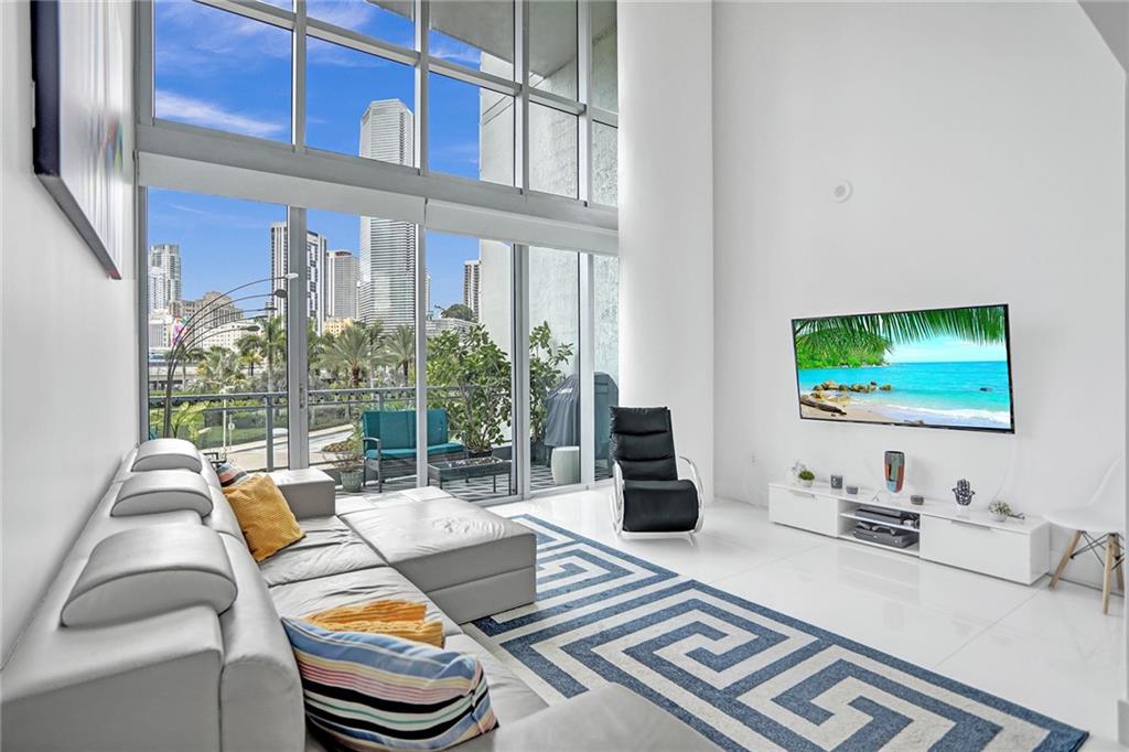 Rarely available unique living environment in this extraordinary Two-Story loft in the heart of Brickell, Open, bright and airy floorplan This loft showcases elegant white porcelain florrs that span the entire space. The modern kitchen is equipped with sleek appliances, while upstaris, a spacious principal bedroom offers ample room for both livin and working. Step out onto the charming tiled balcony and soak in the ambiance and incredible Brickell skiline views. the building itself offerws a plethora of top-notch amenities, including a fitess center, BBQ & picnic area, business center, 24 hour valet parking, and secutiry services. Indulge in the infinity-edge swimming pool and more. Convenietly located close to major expressways.
