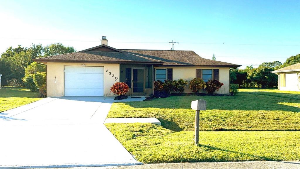 Photo of 2330 SE Avalon Rd, Port Saint Lucie, FL 34952 (MLS # R10946635)