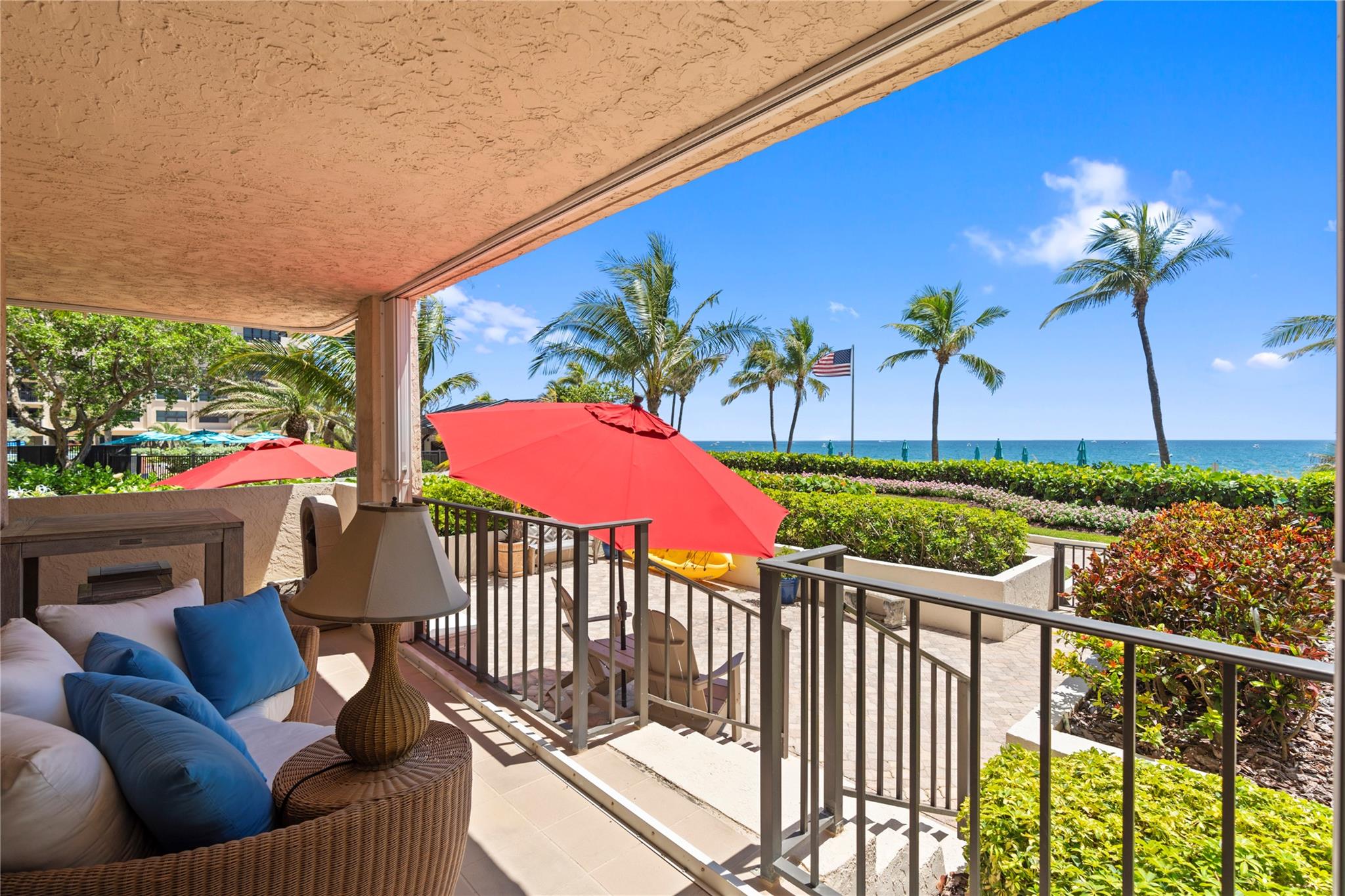 LOOKING FOR A BEACHFRONT HOME? This ground-floor corner condo offers stunning oceanfront views & direct beach access. No elevator required! An expansive private patio is steps from the warm sand. The spacious 2,100 sq. ft. condo has 3 beds/2.5 baths. 2 side-by-side secured garage parking spots w/electrical outlet steps from your front door. Principal ensuite offers double sinks, steam shower, soaking tub, & large walk-in closet. Laundry room in unit, wine fridge & so much more. Lease day one. AMENITIES: 14 Acres of Deep Beachfront, 3 Heated Pools, 3 Open-Air Kitchens W/Gas Grills, Beachfront Charcoal Grills & Picnic Tables, 8 Oceanside Tennis Courts & 2 Pickleball Courts, 2 Herb Gardens, 2 Pet Parks, Dry Saunas, Gym, 3 EV Charging Stations, 2 Car Wash Areas, & 24-Hour Front Desk Personnel.