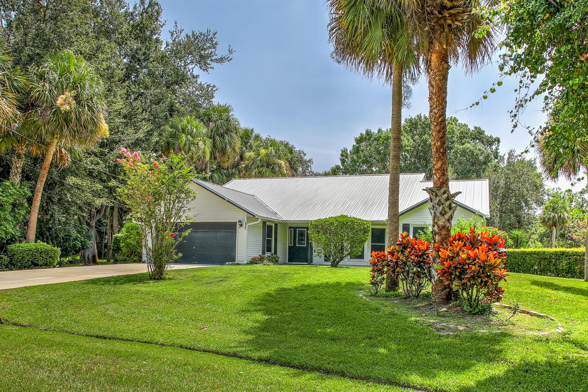 MUST SEE to Appreciate!This beautifully maintained 2-bedroom, 2-bathroom, 2-car garage home offers 1,713 sq ft of comfortable living in a quiet, prime location. Split floor plan features an updated kitchen and all appliances, open to family room perfect for entertaining family and friends. Enjoy both a screened patio and an open patio, overlooking a stunning oversized yard with mature trees, lush landscaping, and plenty of space to add a pool. Conveniently located near Gatlin and Tradition, with easy access to shopping, dining, and entertainment. Quick access to I-95 and Crosstown Parkway makes commuting a breeze. Don't miss this exceptional opportunity--schedule your private tour today!=