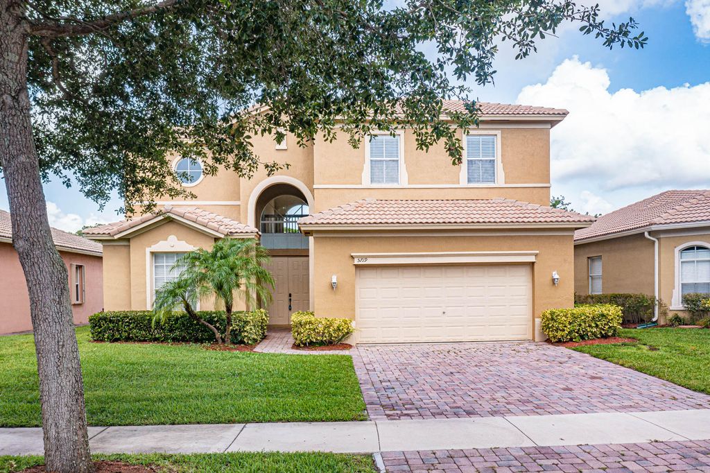Photo of 5719 Place Lake Dr, Fort Pierce, FL 34951 (MLS # R10808637)