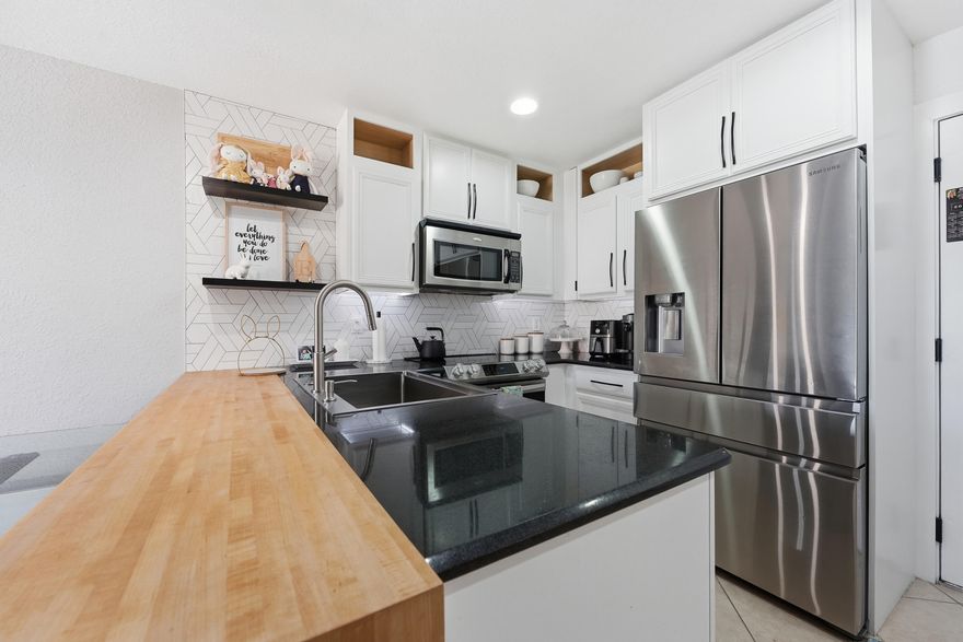 Step into this beautifully maintained 3 bedroom, 2.5 bathroom home offering comfort, style, and thoughtful upgrades throughout. The open-concept living area features a custom built in TV unit and abundant storage, creating a functional and inviting space for everyday living. The modern kitchen flows seamlessly into the dining and living area, making it ideal for entertaining. Upstairs, the spacious bedrooms provide privacy and comfort, including a well-appointed primary suite with its own ensuite bathroom. Additional highlights include a 1 car garage, a whole home water softener, an energy efficient tankless water heater and accordion shutters. With numerous upgrades and smart features, this home delivers convenience and peace of mind in every detail.