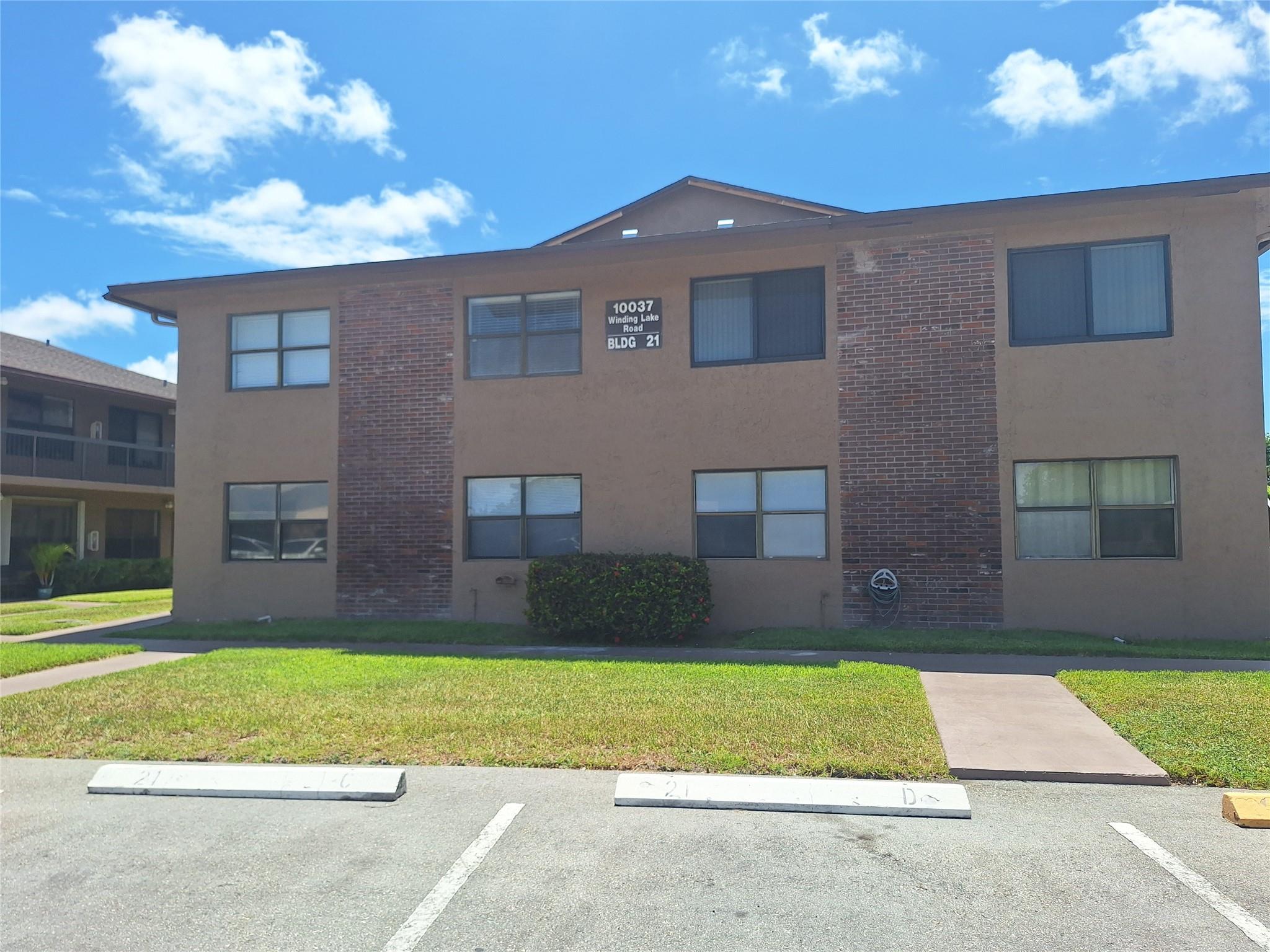 This well-maintained first-floor condo is located in the heart of Sunrise, within the Welleby Winding Lakes community. It features spacious rooms filled with natural light and wood flooring throughout. The unit includes a washer and dryer for added convenience. Residents can enjoy a community pool and tennis courts, and it is conveniently close to Sawgrass Mall, major highways, and various shops, with Publix within walking distance. The condo comes with one assigned parking space and plenty of visitor parking. Please note, a minimum credit score of 650 is required.