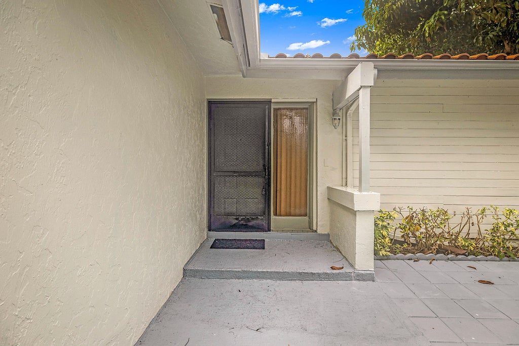 Photo of 2780 NORFOLK PINE Court, Lake Worth, FL 33462 (MLS # B26076064)