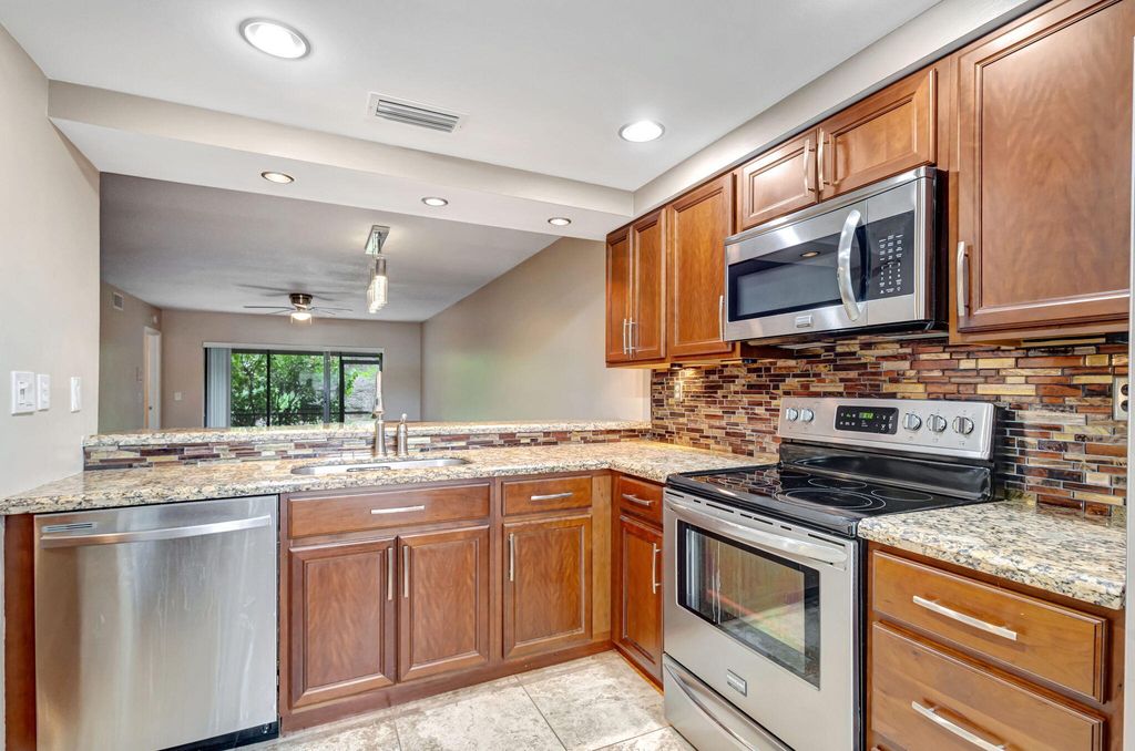 Photo of 2001 Sabal Ridge Court #C, Palm Beach Gardens, FL 33418 (MLS # R11065099)