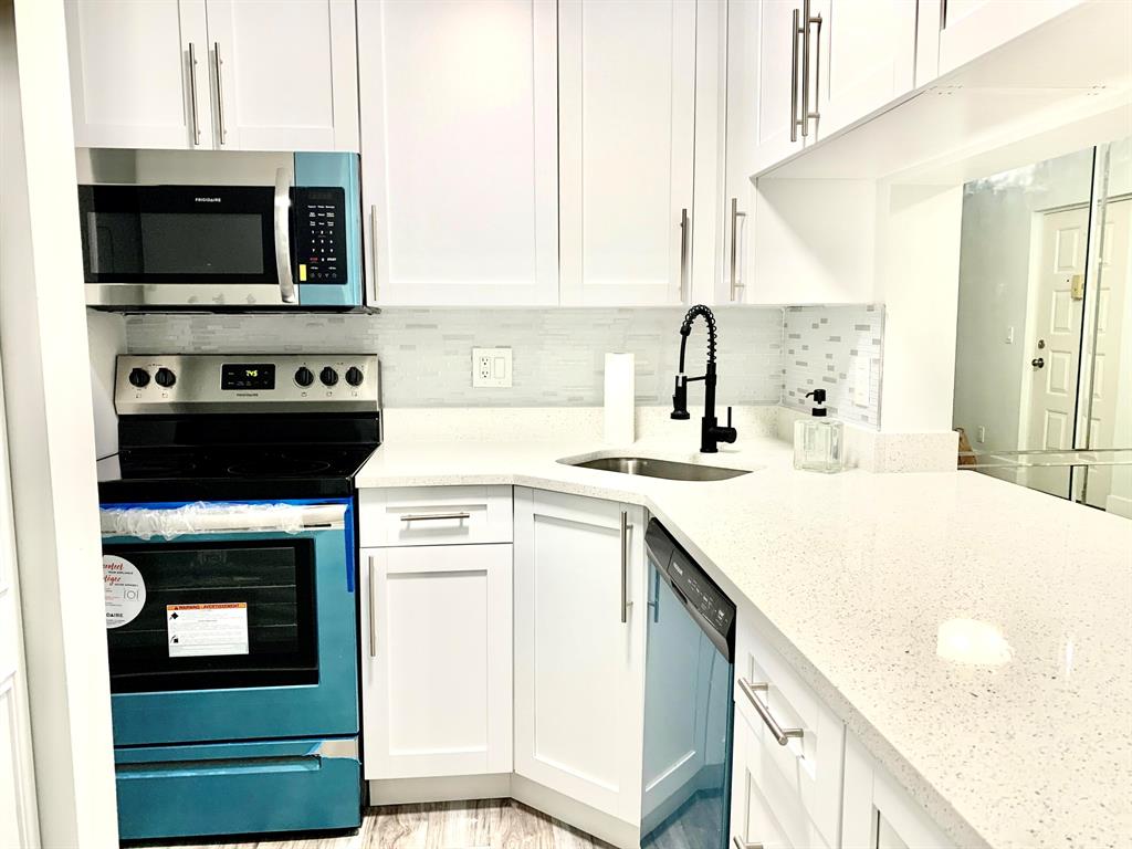 Move in to this newly renovated property with Brand new Kitchen with brand new Stainless Steel Appliances. New wood flooring, freshly painted and renovated bathrooms. On site laundry. No Age Restrictions! All of this with an excellent location: Just 3 Minutes from Okeeheelee Park, 2 Minutes from Publix, Walmart, Gyms, gas stations, 7 minutes from Wellington Mall and more, Easy to commute to I95 and Fl. Turnpike. Just bring your tooth brush!! Don't miss this one!Community features: Lake with walking trails, Club House with Pool and games, common areas with grills and more. Just bring your tooth brush!! Don't miss this one!