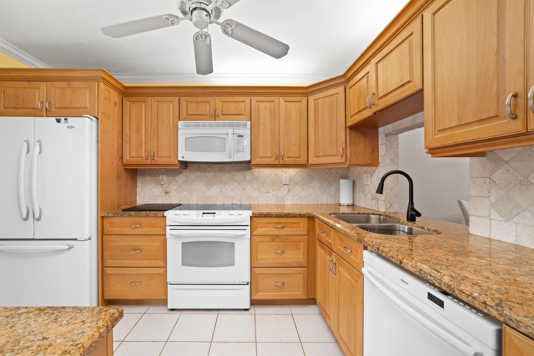 Discover your dream home in this stunning 2 bed, 2 bath pool front condo located in the desirable Monaco Gardens. Just under a mile from the beach, this charming ground floor unit features a welcoming porch and a screened-in patio, offering serene views of the garden and pool area. Enjoy abundant natural light throughout, enhancing the spacious feel of the living space. Each bedroom boasts its own ensuite bathroom, complemented by walk-in closets and ample storage for all your needs. Dive into relaxation with a heated pool, and enjoy the convenience of nearby shopping and dining options. Experience the perfect blend of comfort and lifestyle in this exceptional condo!