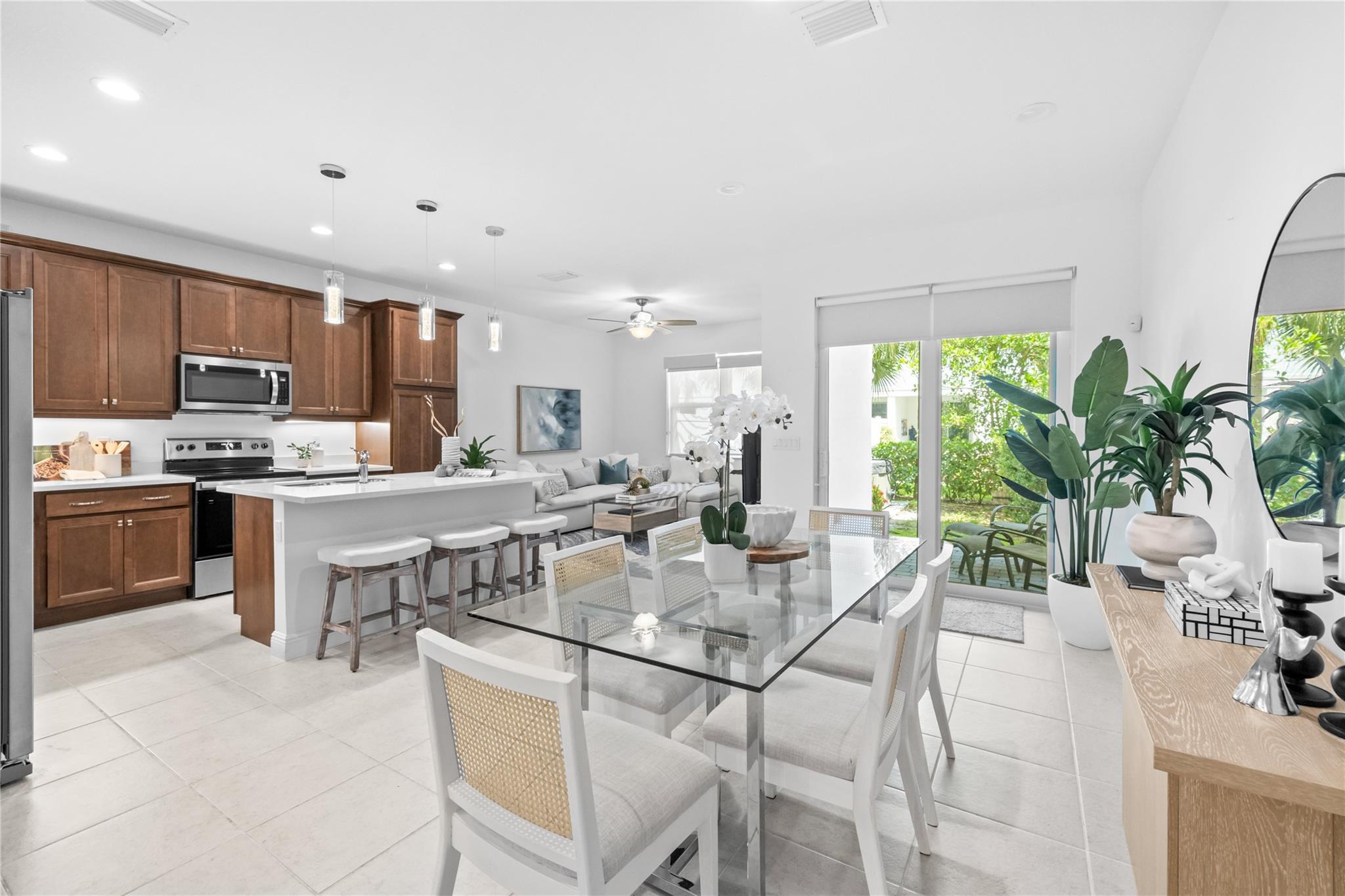 Priced to sell! Stunning 3/2.5 townhome with loft and split floor plan in Deerfield's gated Sandpiper Point. Built 2021, this unit is turnkey. Features include impact windows, 9-ft ceilings, and an open-concept layout. Large walk in in primary bedroom and dual vanity sinks. Private fenced yard w/ hot tub. Resort-style amenities: pool, gym, playground, guest parking. Low HOA ($247/mo) incl. cable & internet. Prime location near Deerfield Beach Pier, dining, & Quiet Waters Park. Easy access to I-95. Attached garage. Rental-friendly community makes this a top choice for owner-occupants or investors seeking strong ROI. Less than 1 mile from places of worship. Owner barely occupied the unit, it is practically still new! Good luck and stay friendly!