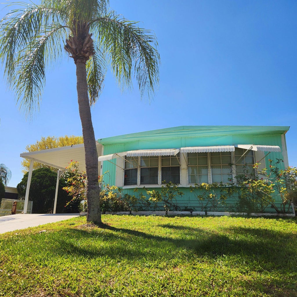 Photo of 82 E Caribbean, Port Saint Lucie, FL 34952 (MLS # R11066605)
