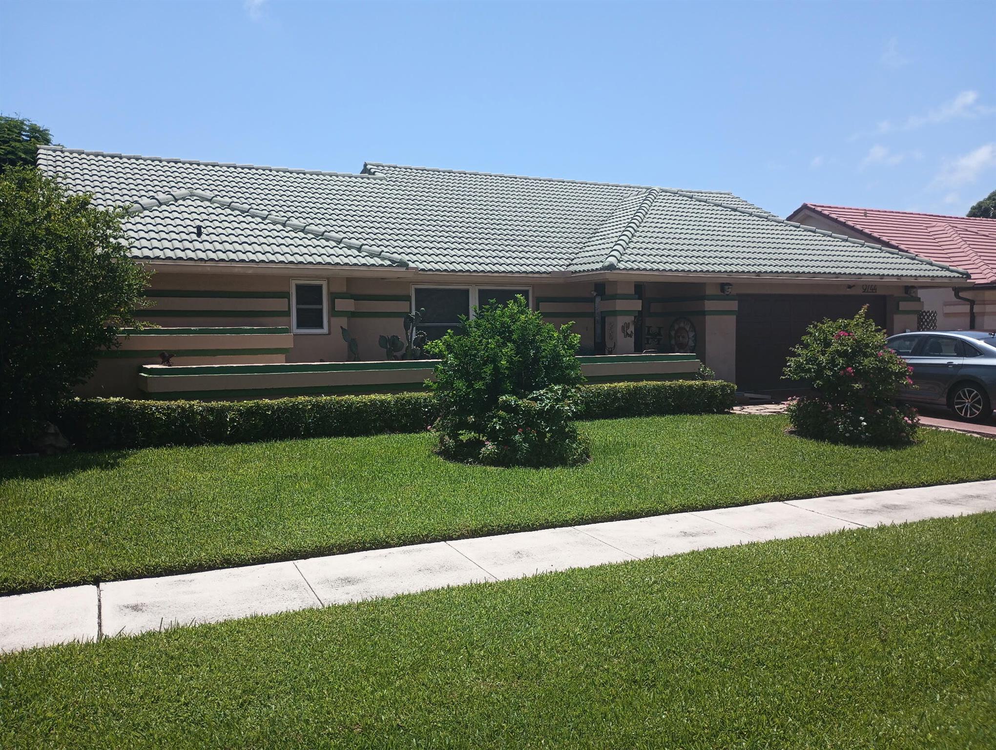 Over $50K in recent renovations! Step into this spacious 4BR/2BA home where comfort meets coastal charm. The kitchen features Corian countertops and newer SS appliances. The primary suite includes an ensuite bath and sliding glass doors leading to a lush tropical backyard with mature fruit trees and serene pond views. Pergo flooring throughout living area and bedrooms. Bonus room '03 ideal for a home office, game room, or income potential. Tile Roof '03, newer AC '23, Double pane windows '08, Electric Panel '24, and new Irrigation pump '25. Minutes from top-rated schools, shopping, dining, and beautiful beaches. Book your private tour today!